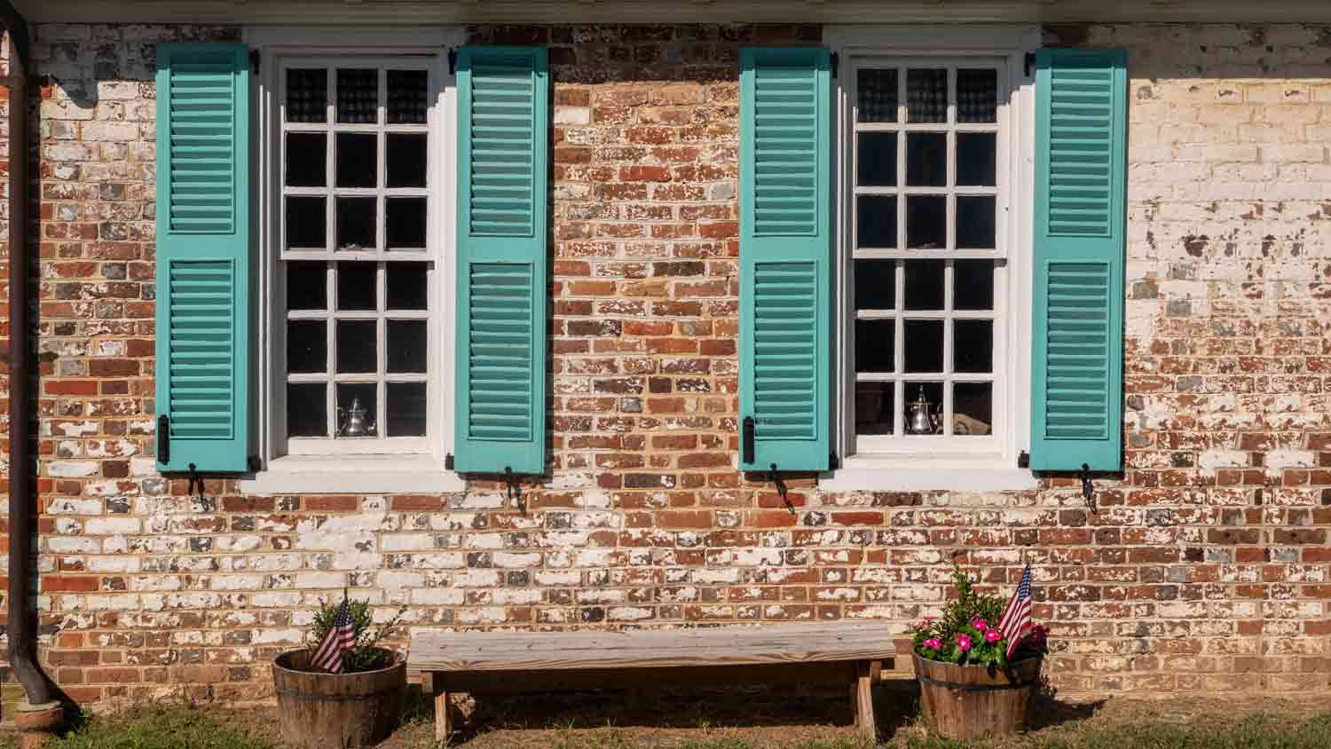 blue shutter on brick house