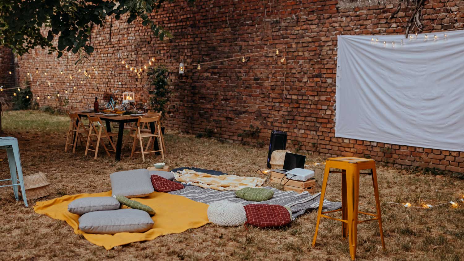 None outdoor movie setup with blankets and cushions
