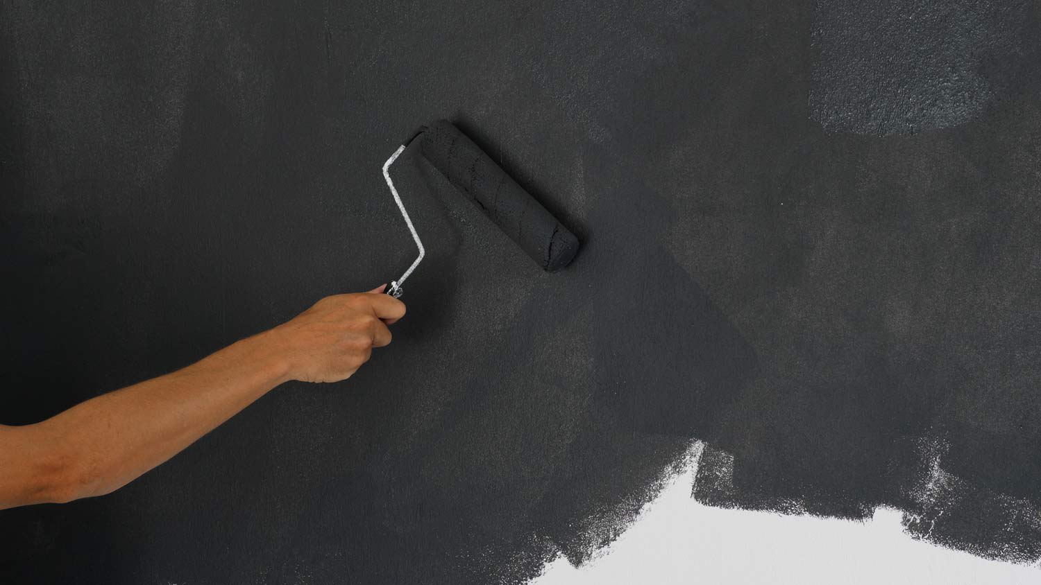 None person using soundproof paint on wall