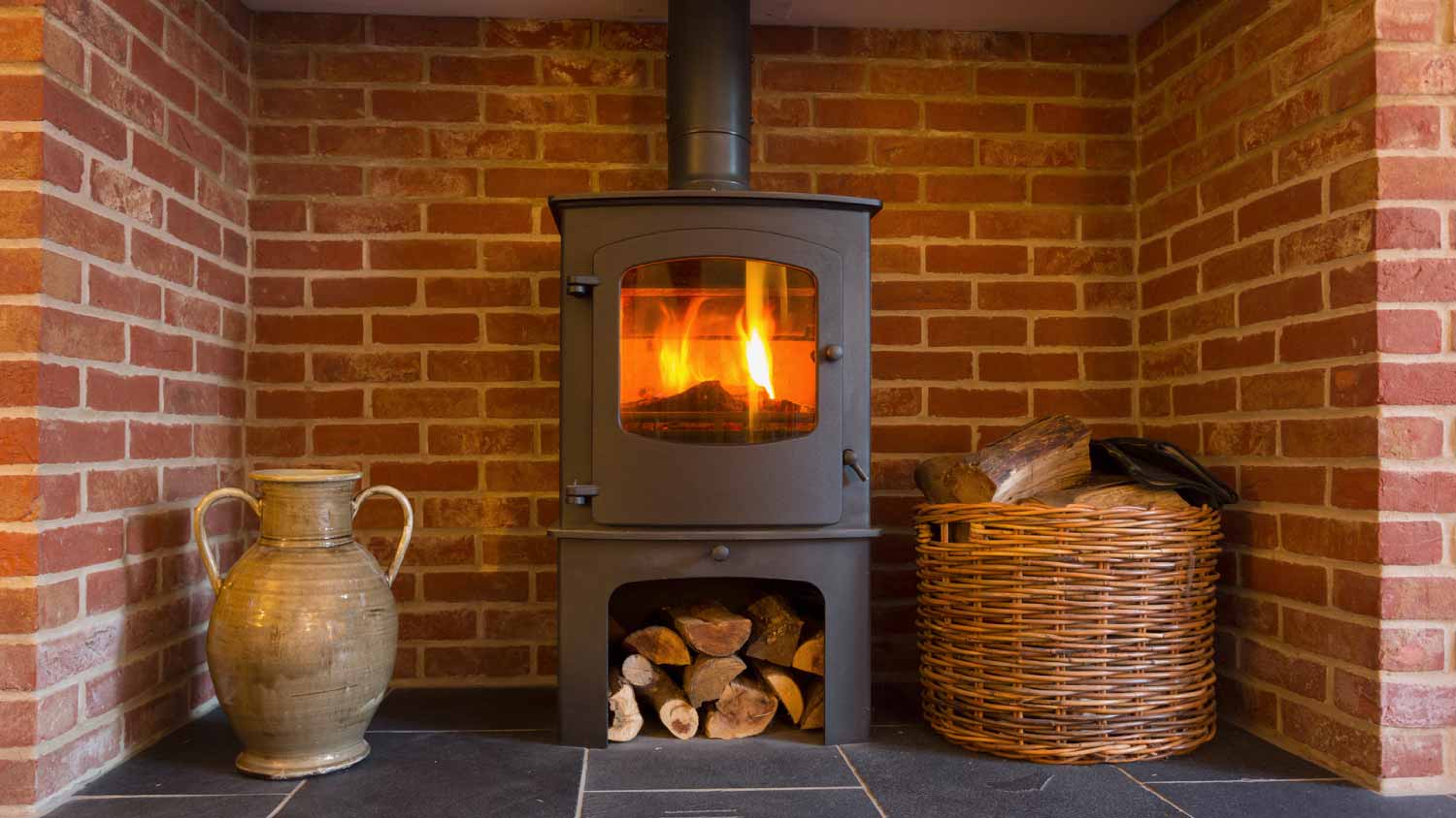 wood-burning stove in brick fireplace