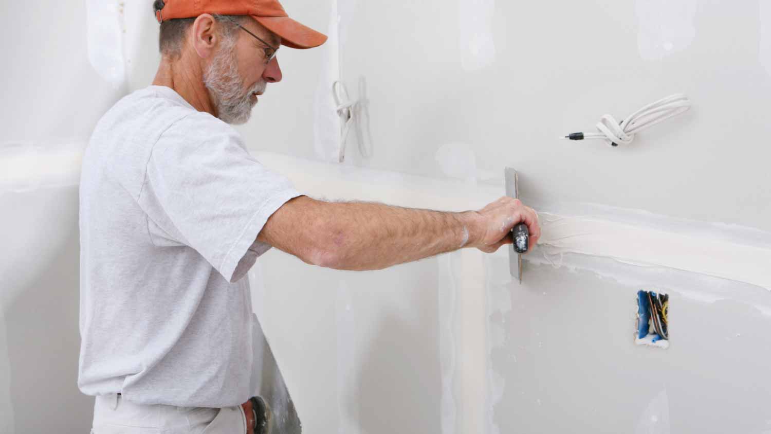 Man applying mud to drywall