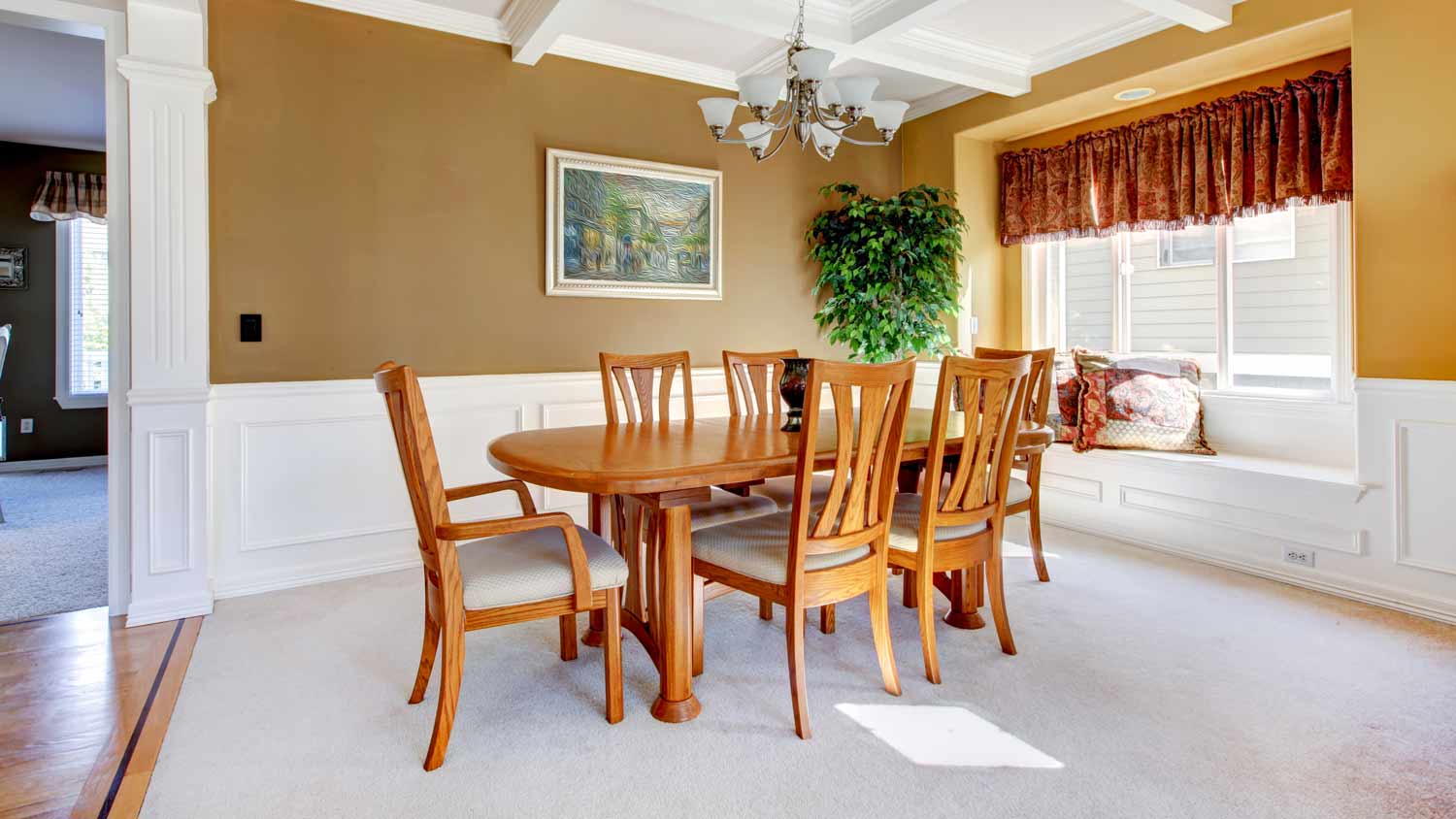 simple dining room with beige carpet