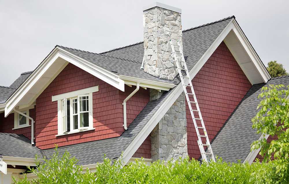 Ladder against house with chimney