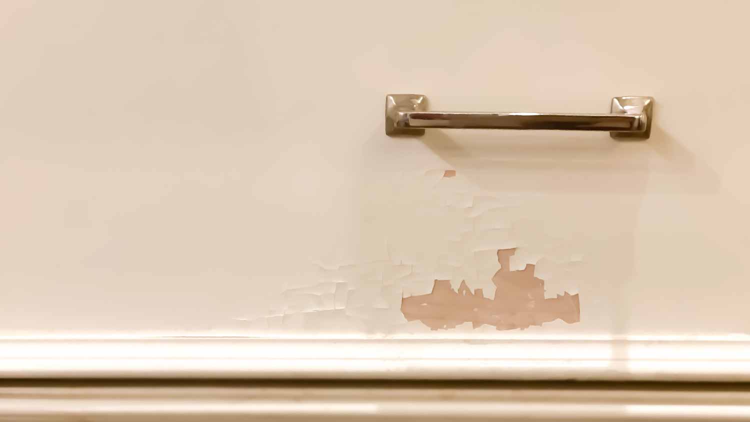 Paint peeling off white kitchen cabinet