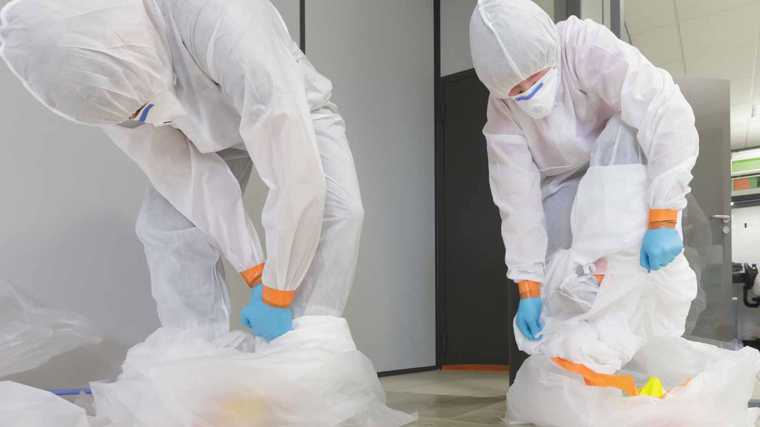 Workers wearing protective suit