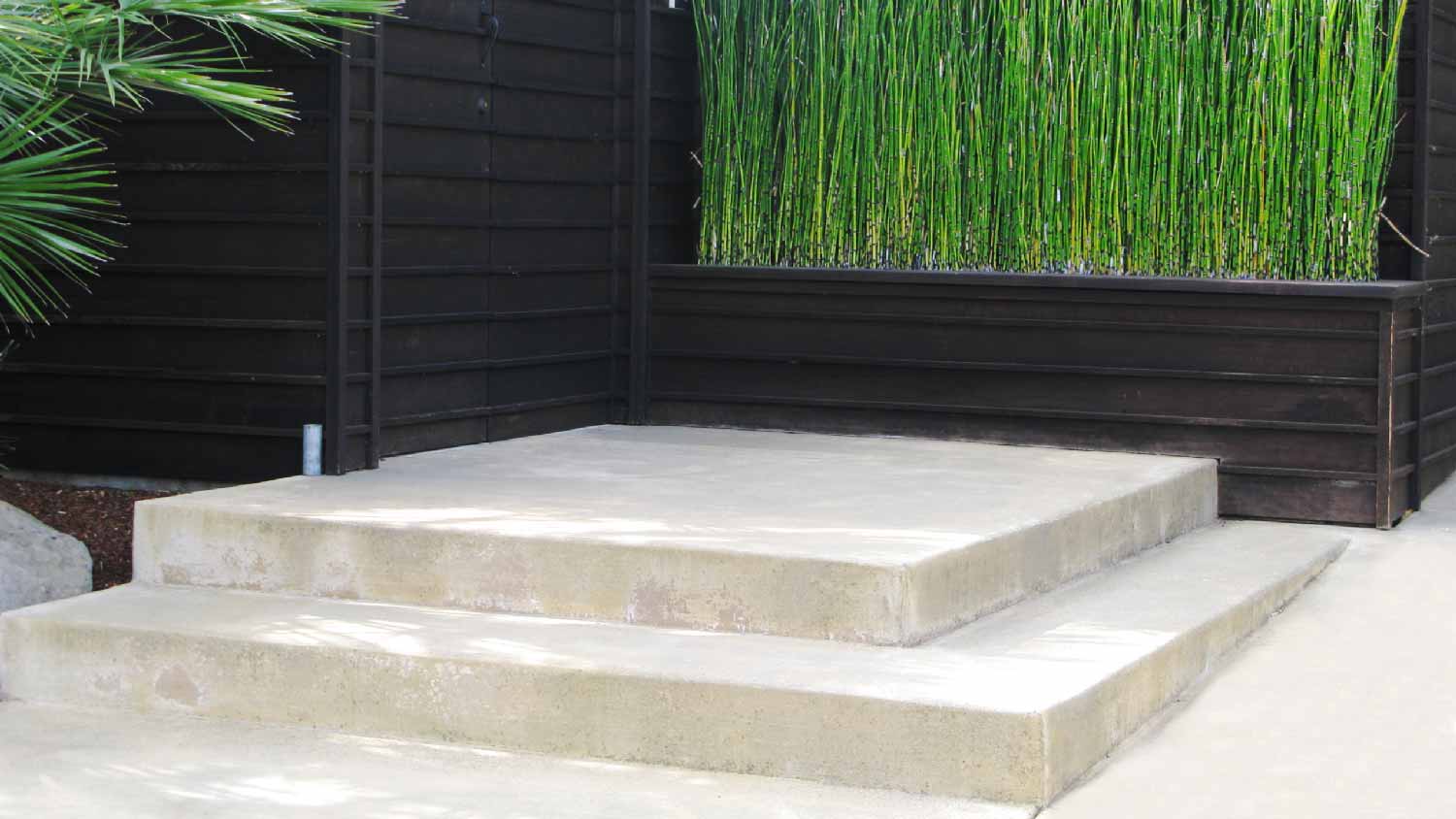 Concrete steps to a Japanese style patio