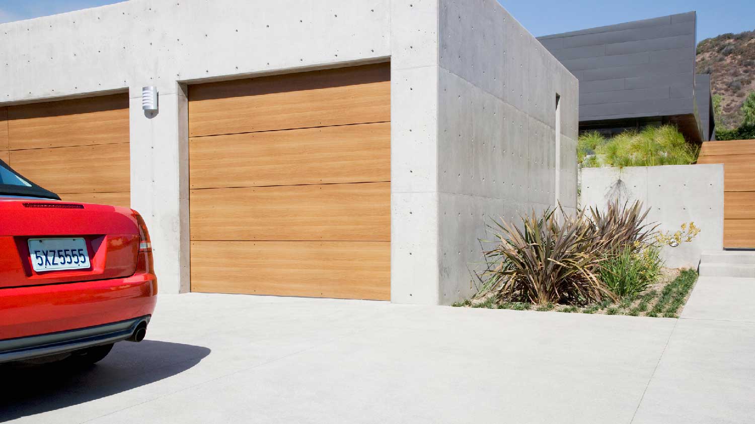 A modern house with a concrete driveway