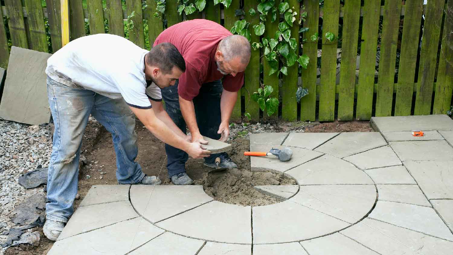 None Two professionals building a concrete patio
