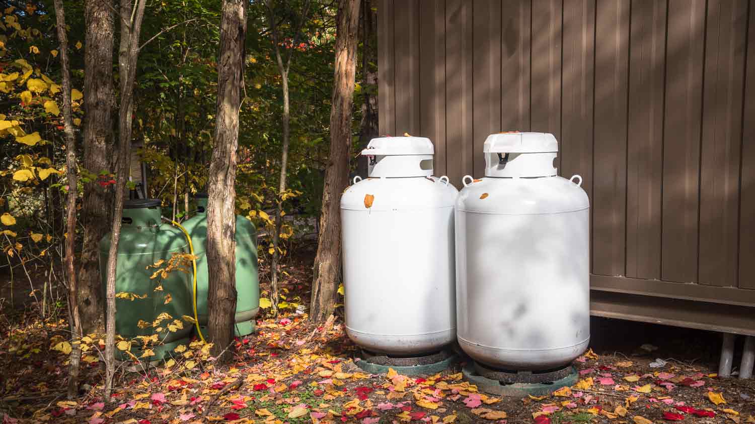 propane tanks outside of house near trees