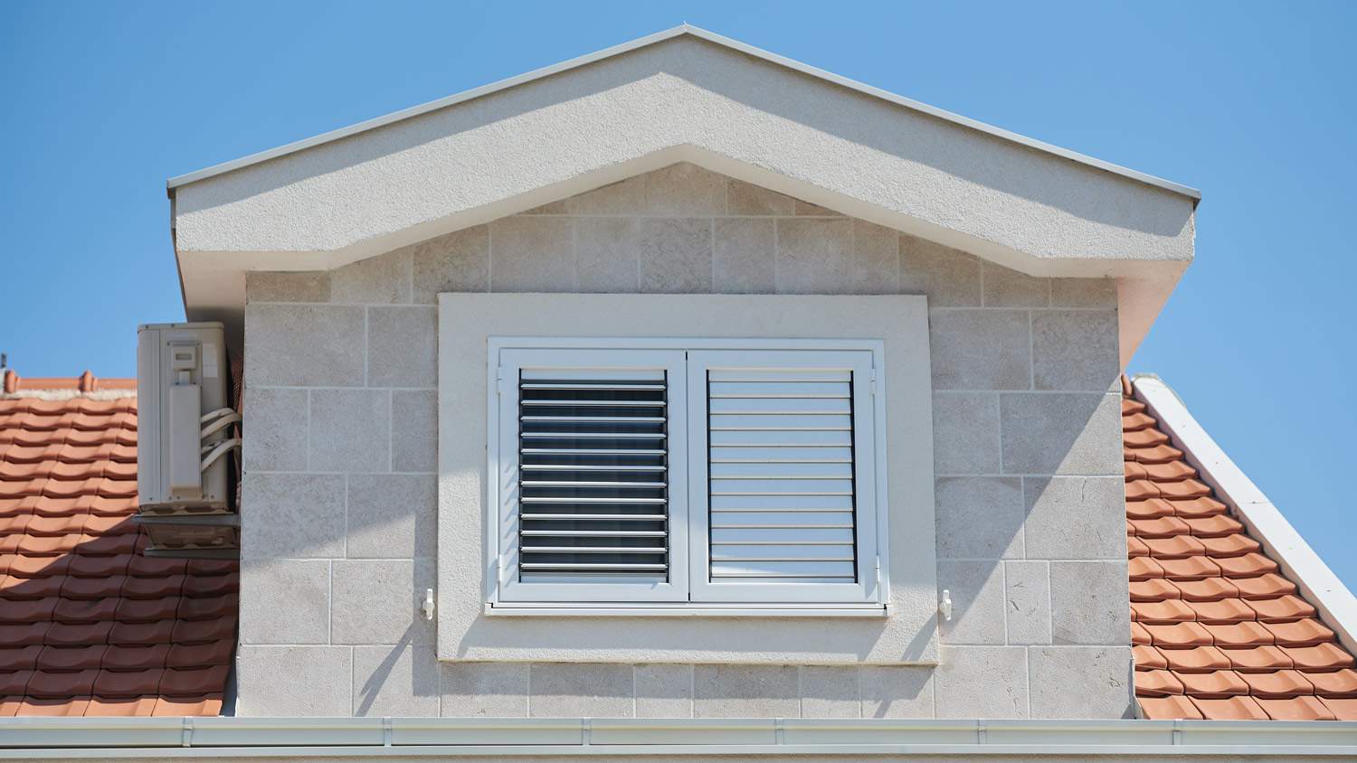 None Plastic external window shutters on a residential building