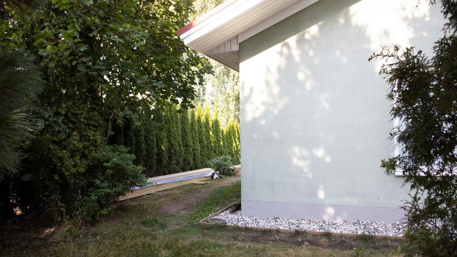 None An exterior wall of a house slightly pulling away