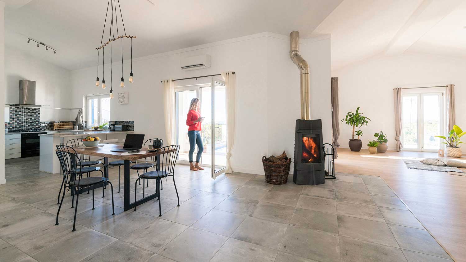 A woman standing in her tiled spacious living room