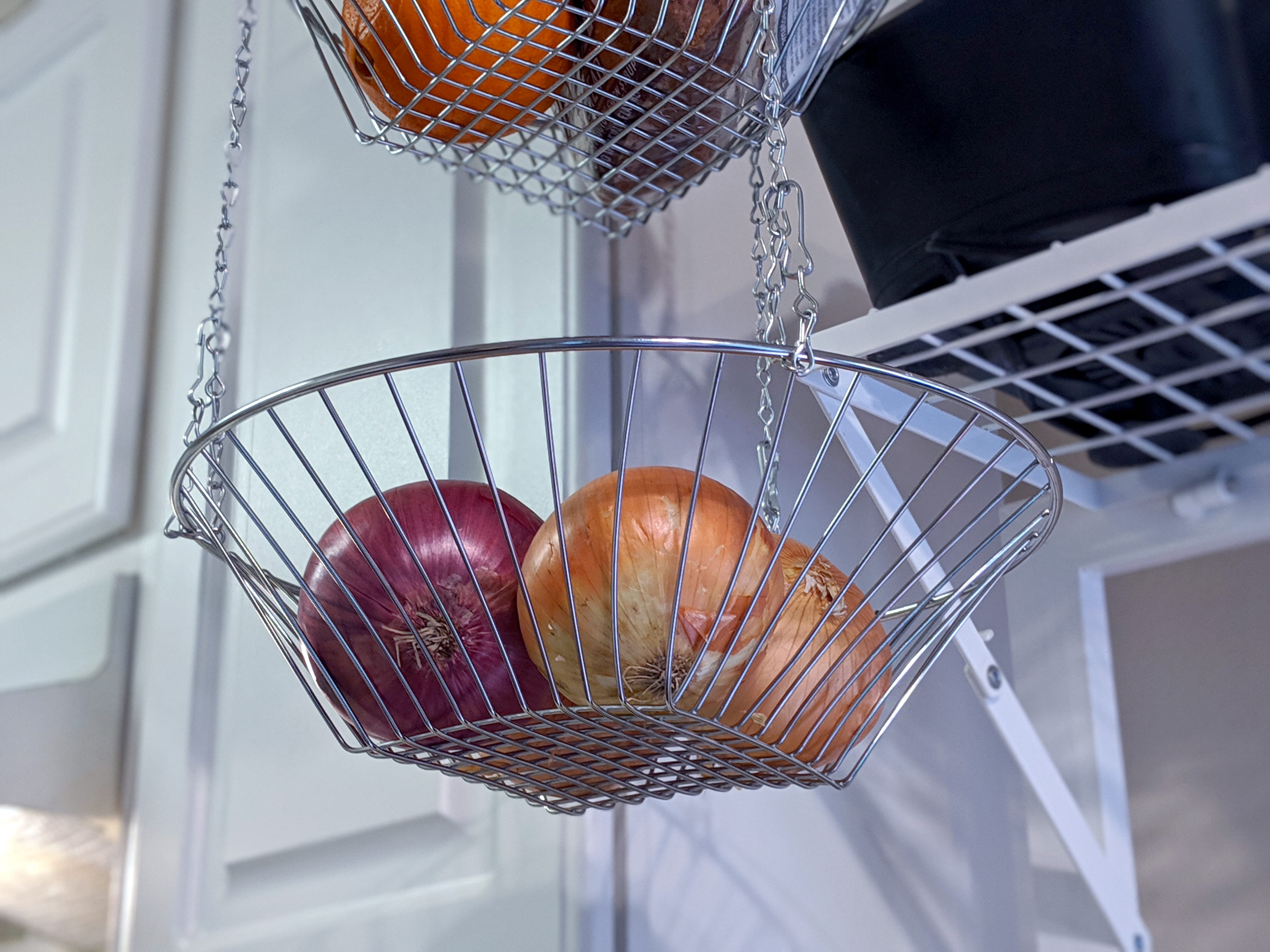 Hanging fruit baskets in kitchen pantry