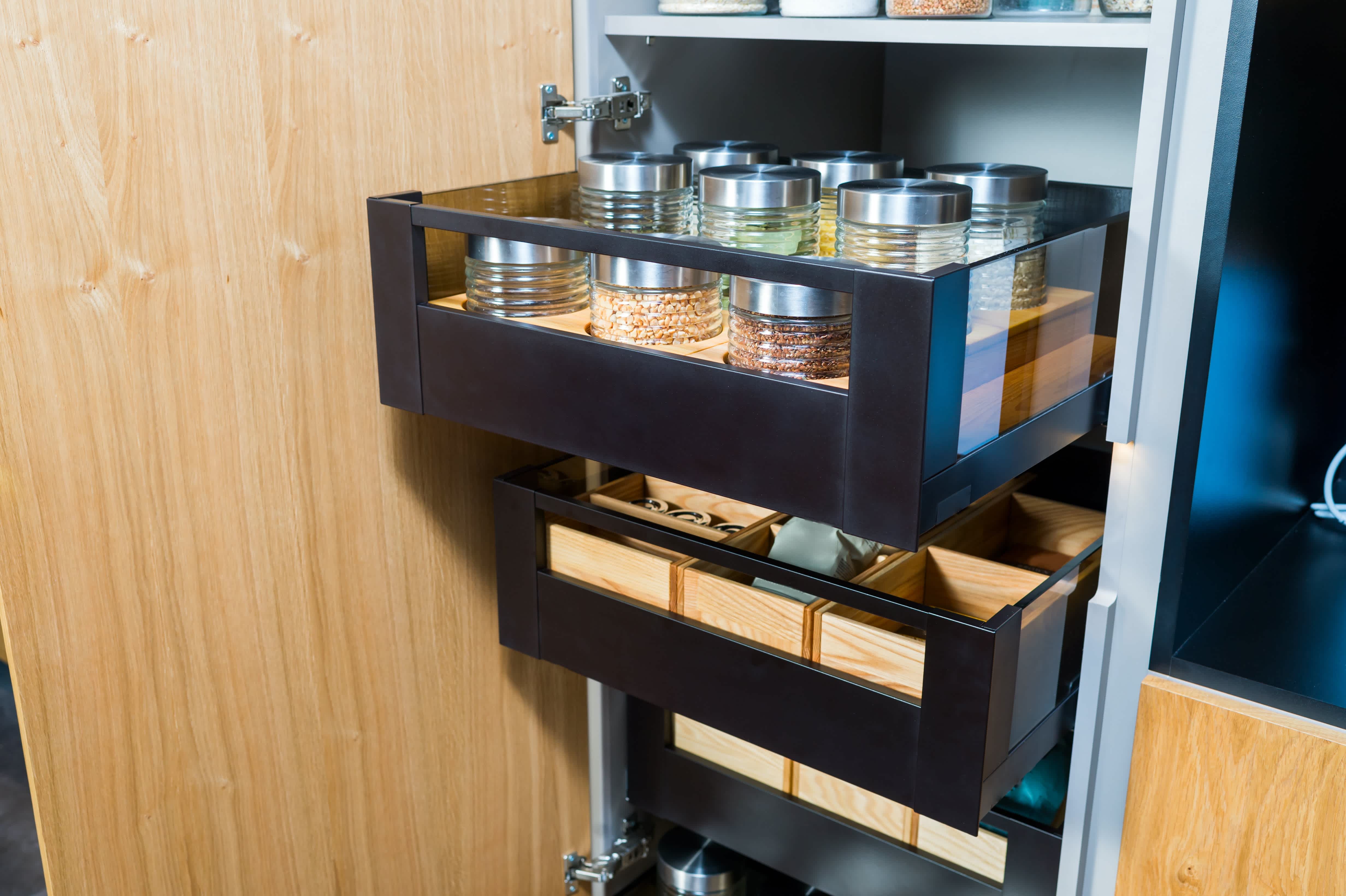 Pull-out drawers in kitchen cupboard
