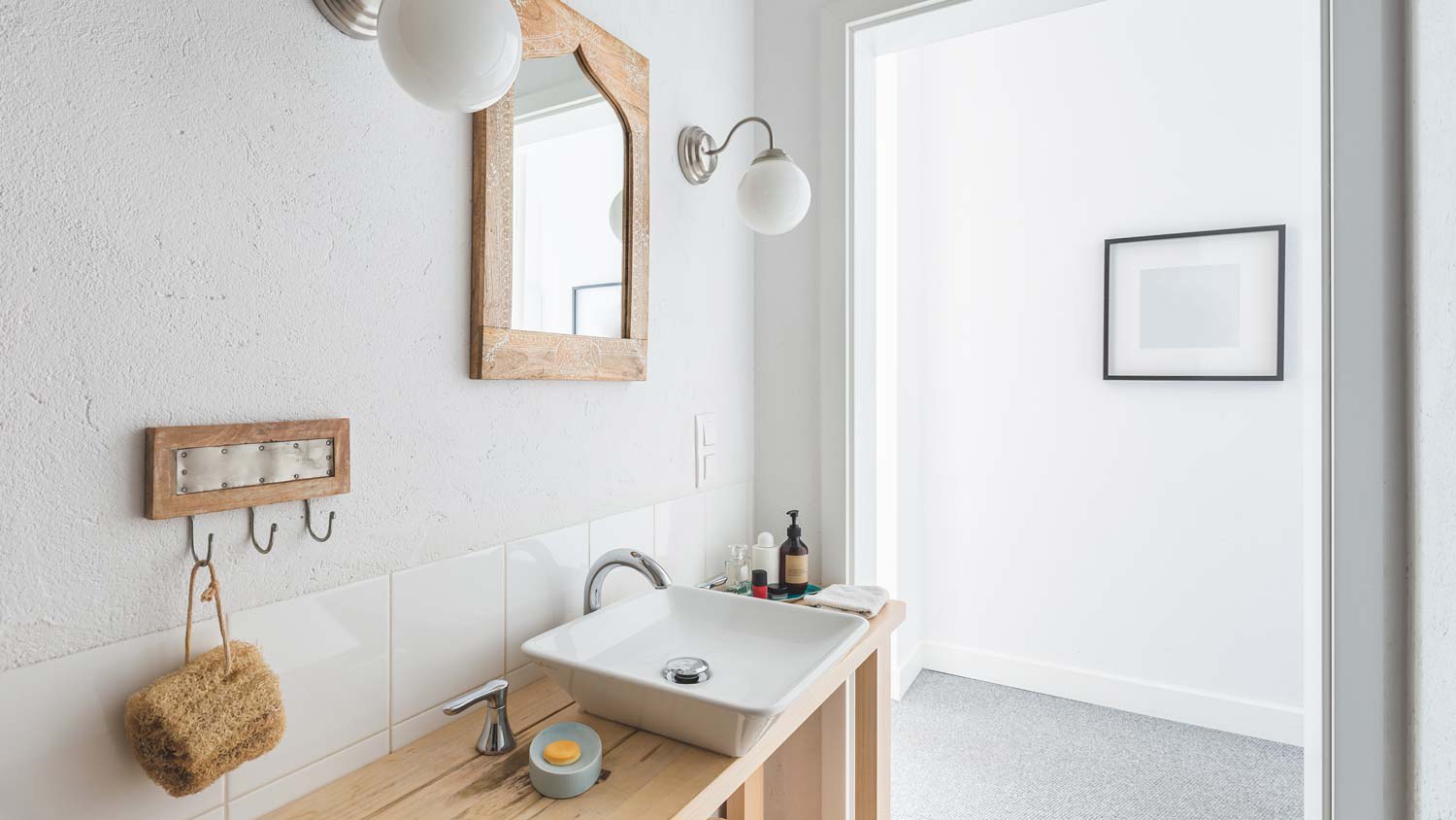 None A stylish ceramic sink in a small elegant bathroom