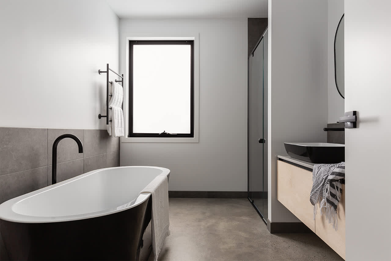 luxury bathroom with concrete floor