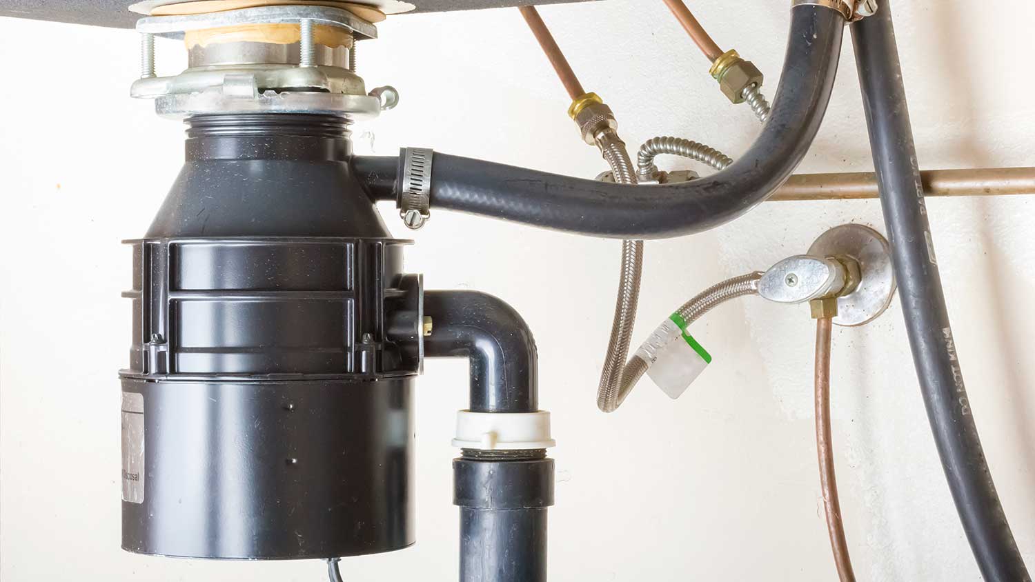 Garbage disposal installed under kitchen sink