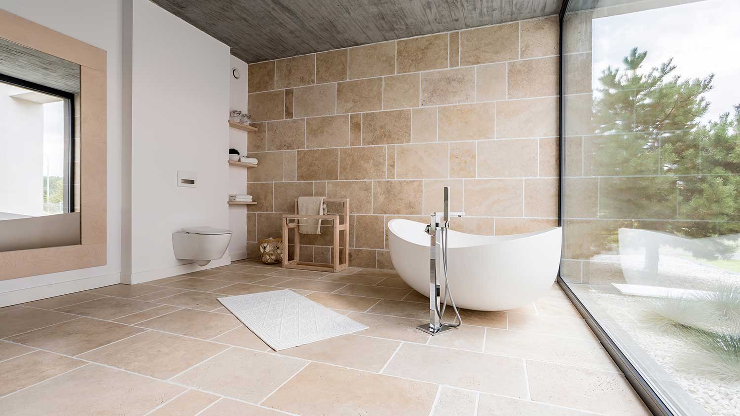 Spacious bathroom with a floor to ceiling window