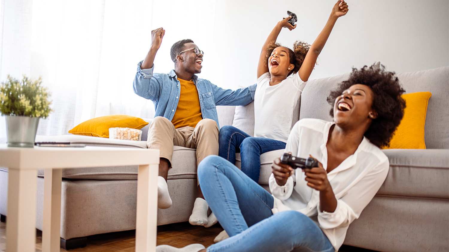 family playing video games in living room