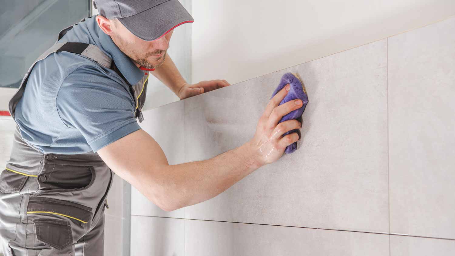 None Worker installing tiles