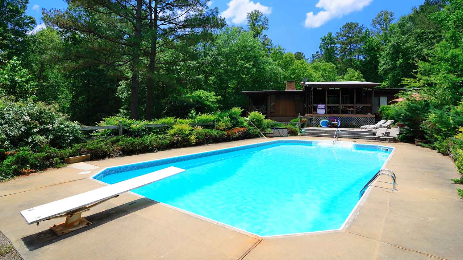 A pool in the backyard of a house