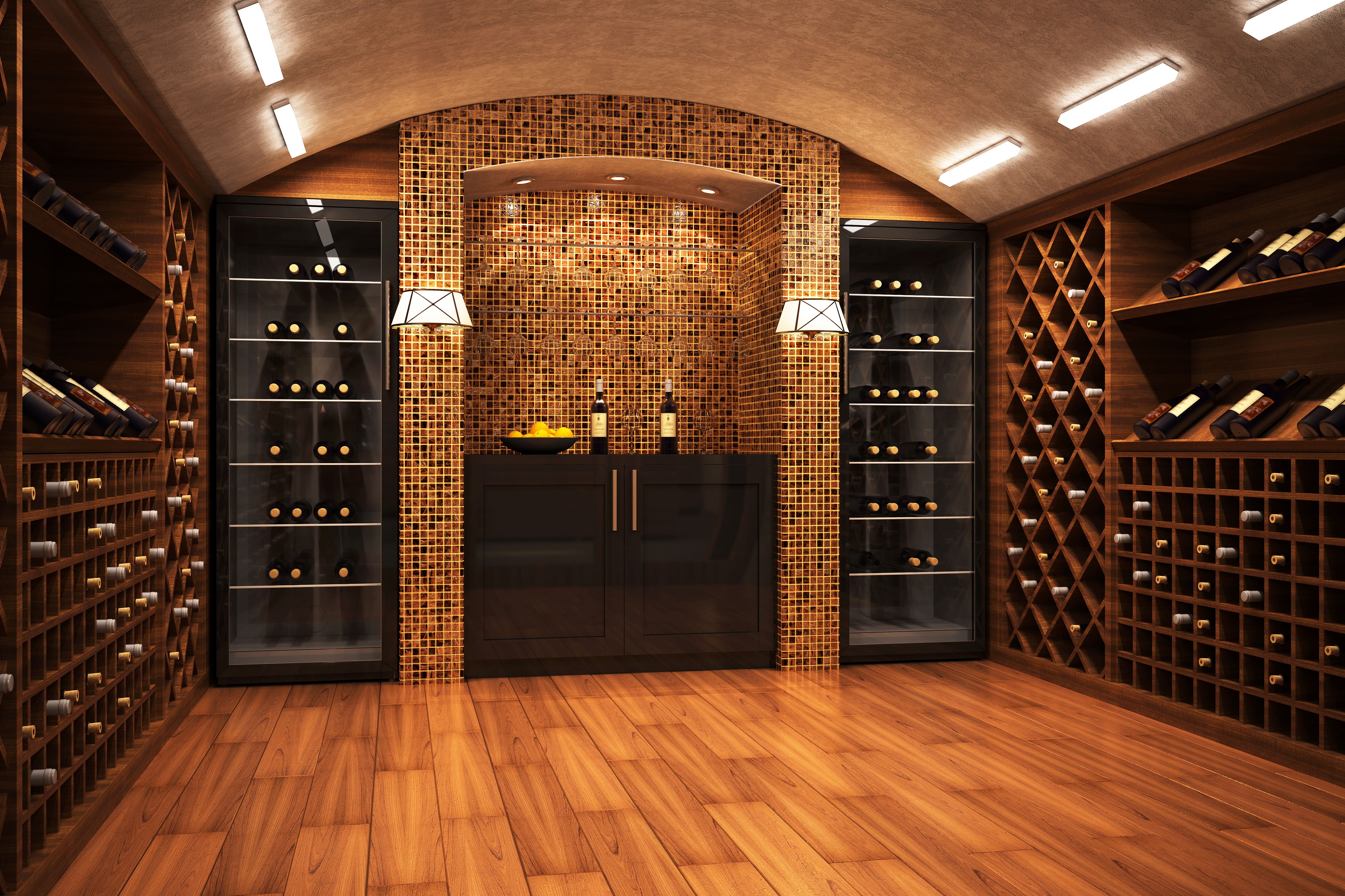 Wine cellar with wall sconces highlighting wine bottle display