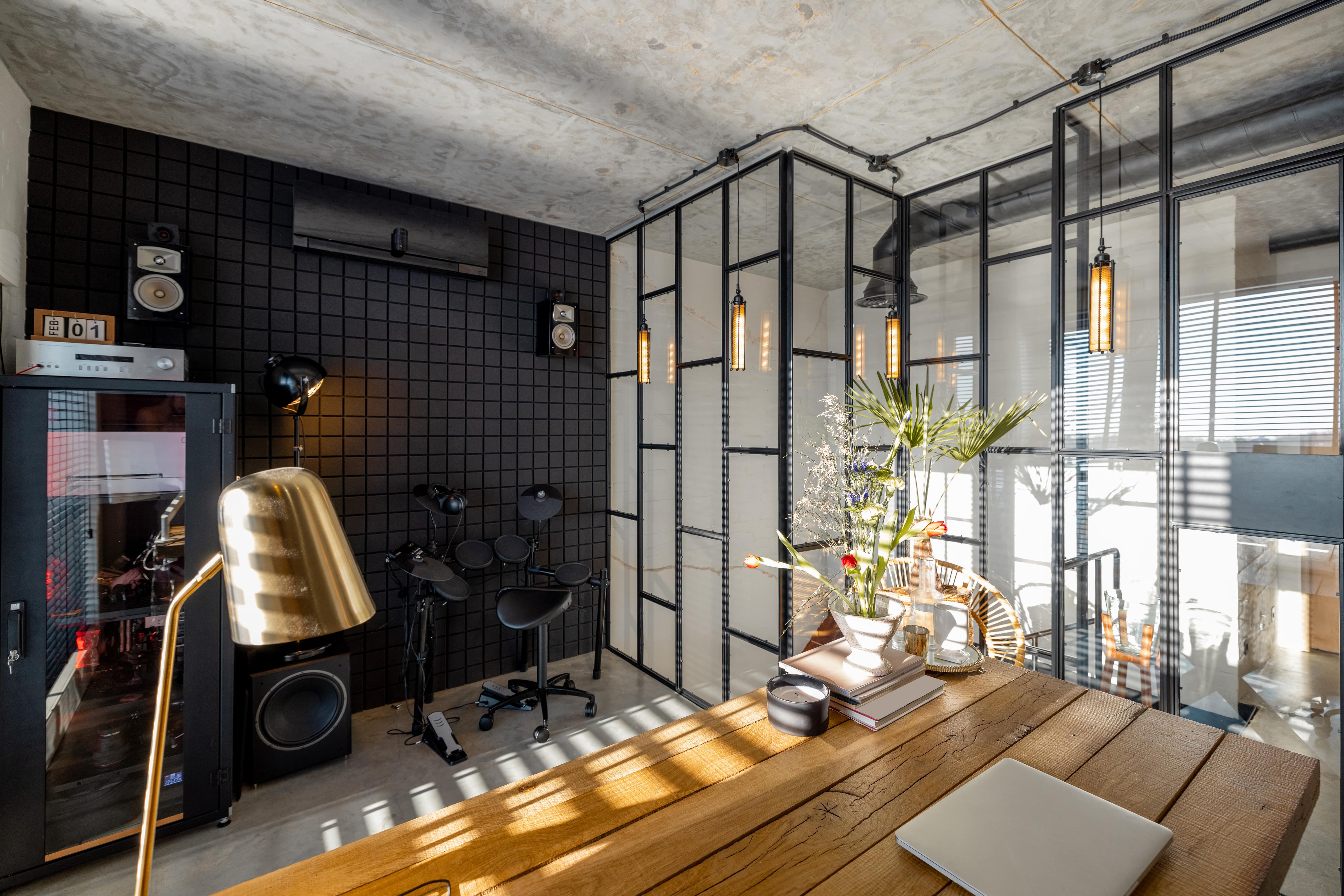 A loft with instruments, speakers and recording devices