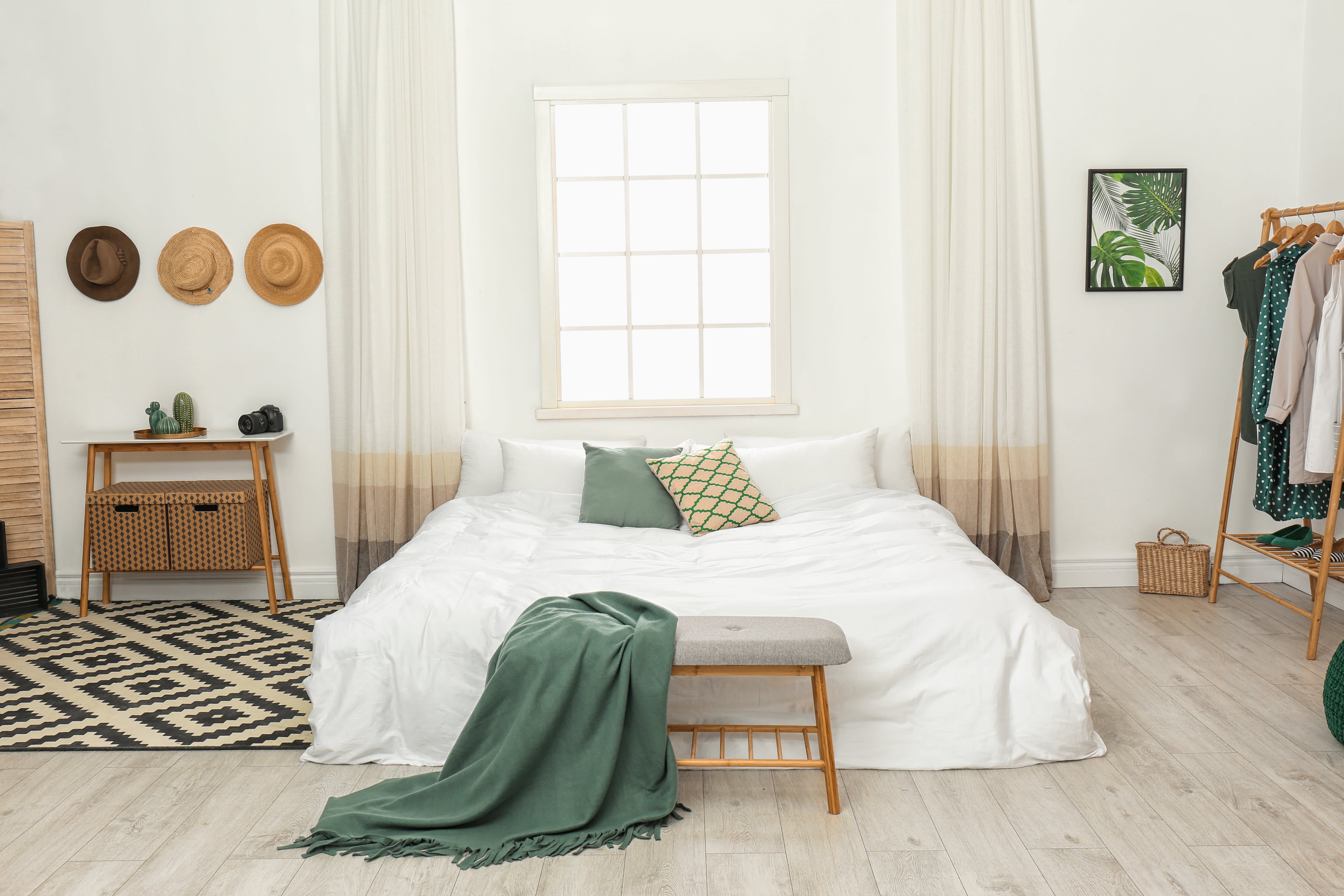 A brightly lit bedroom with a large bed