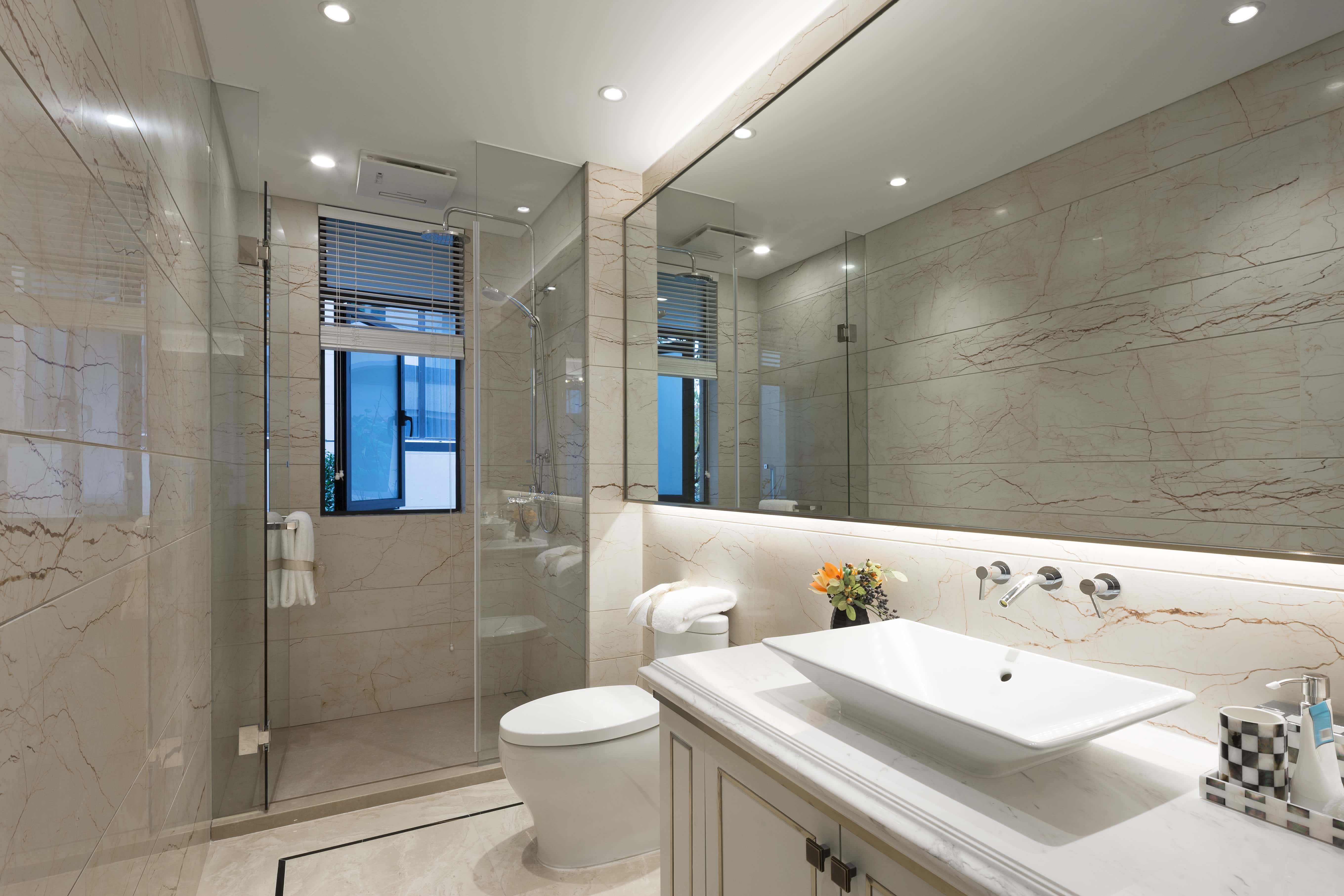 Modern bathroom interior with illuminated mirror