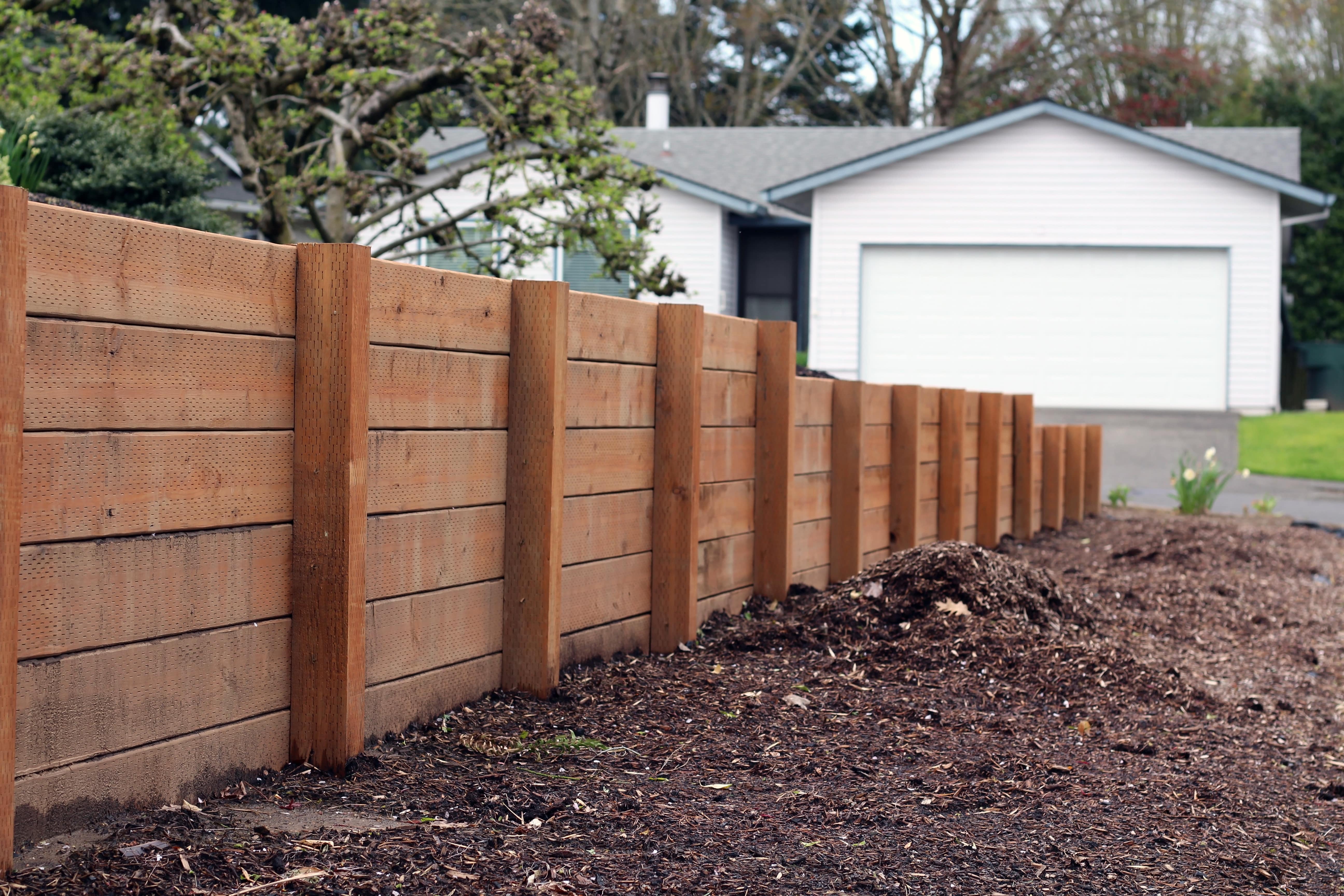 A side profile of a retaining wall made of wood