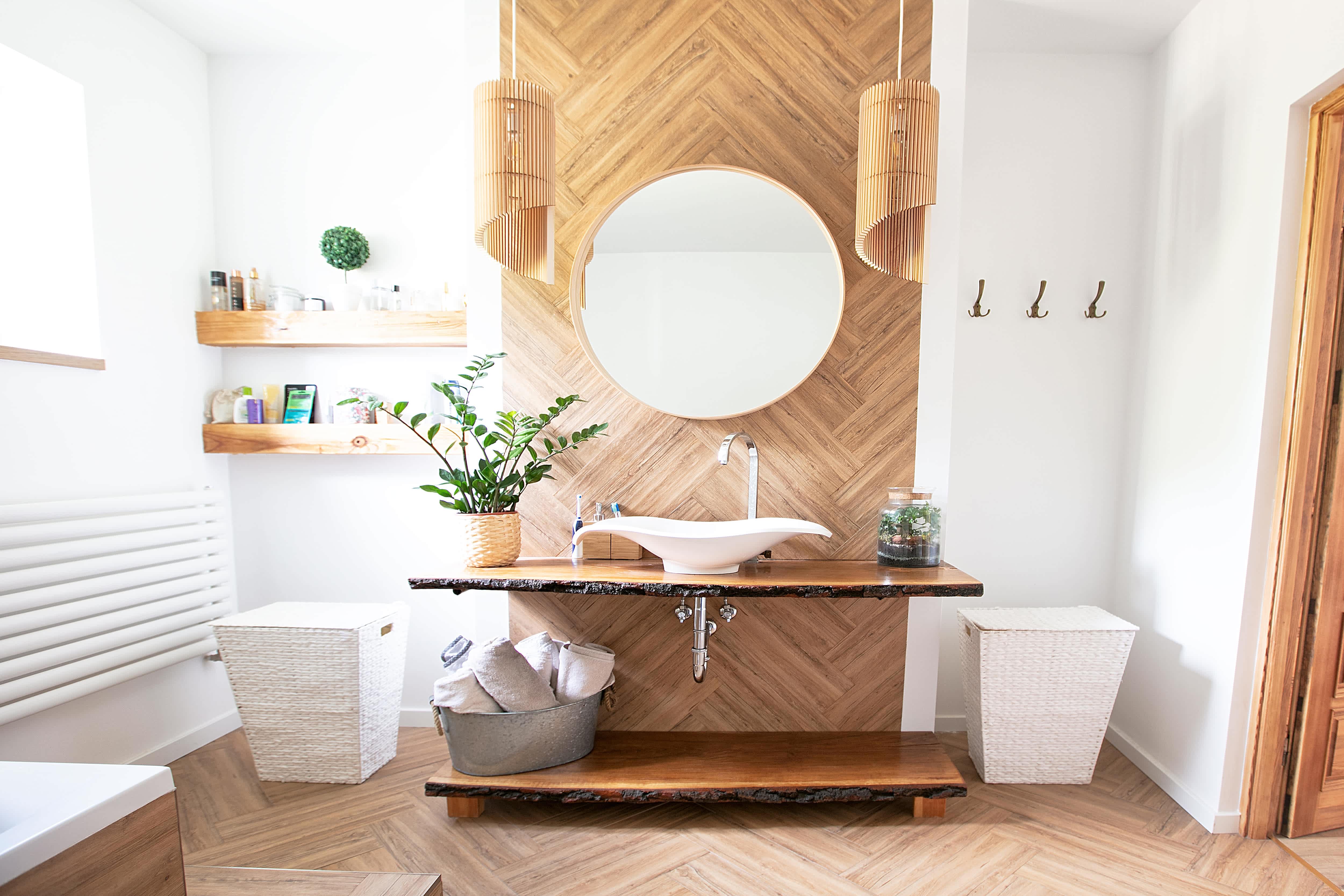 Wooden accent wall behind vanity in modern bathroom