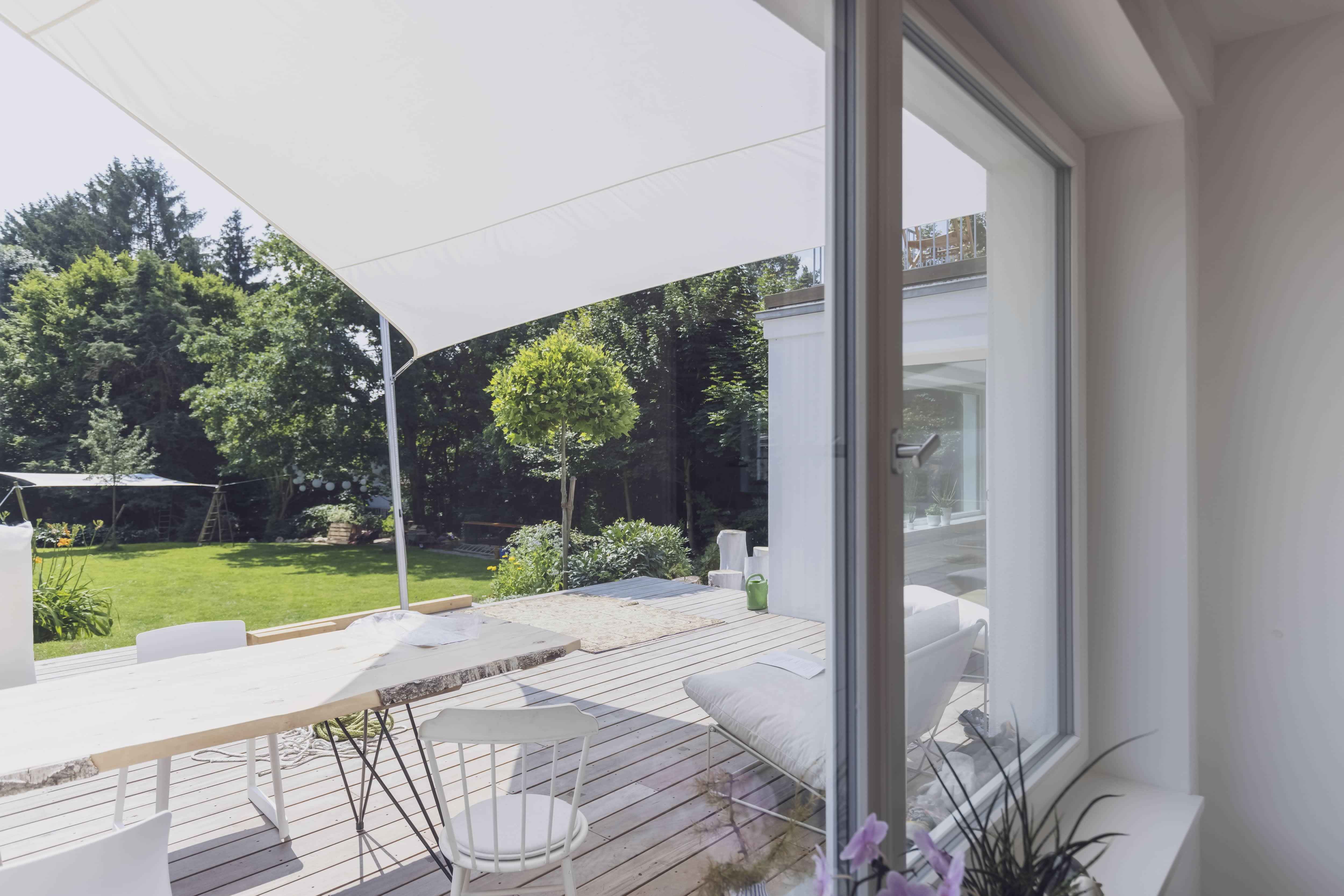 Covered porch with white furniture