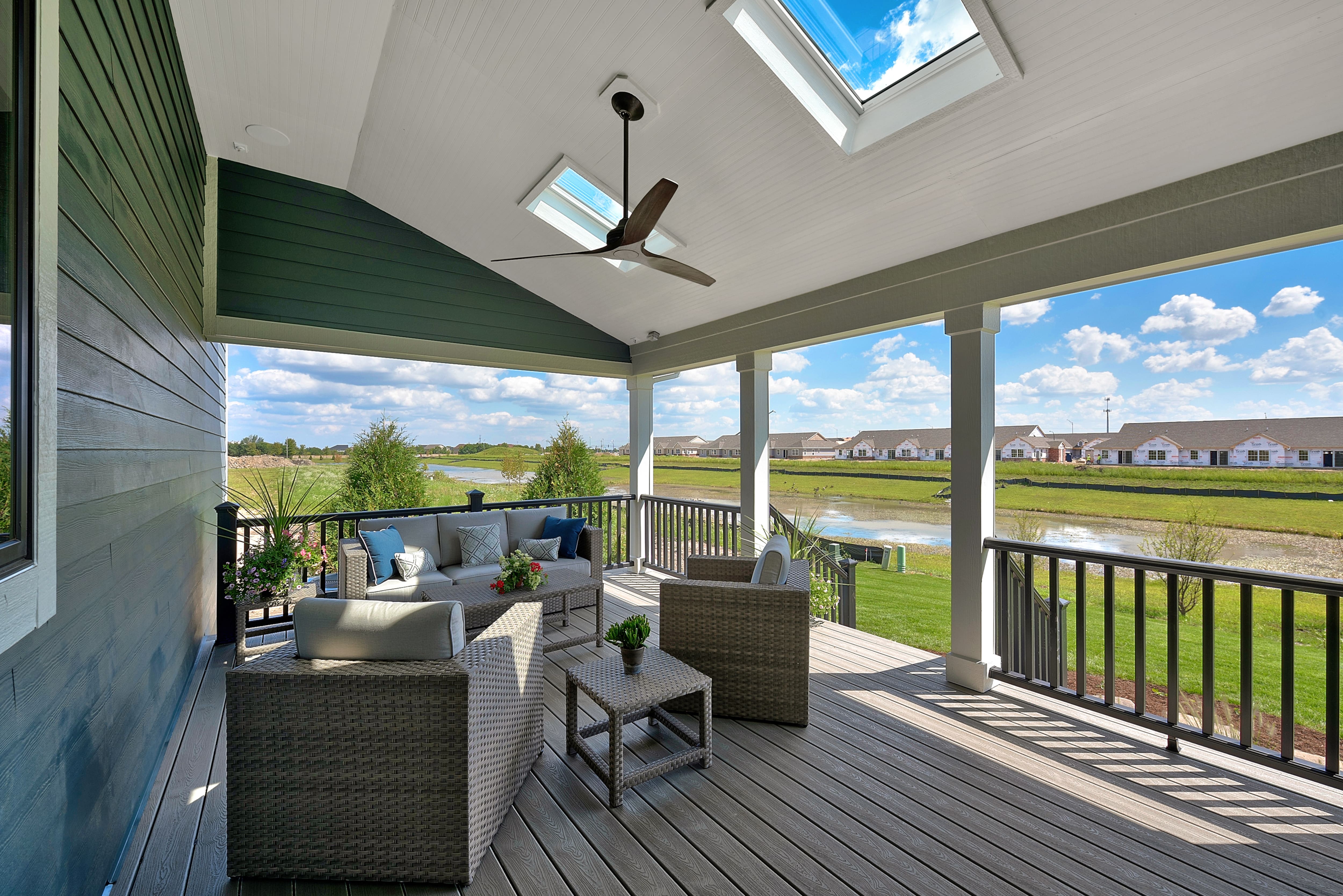 Overhead fan and skylights in covered porch area