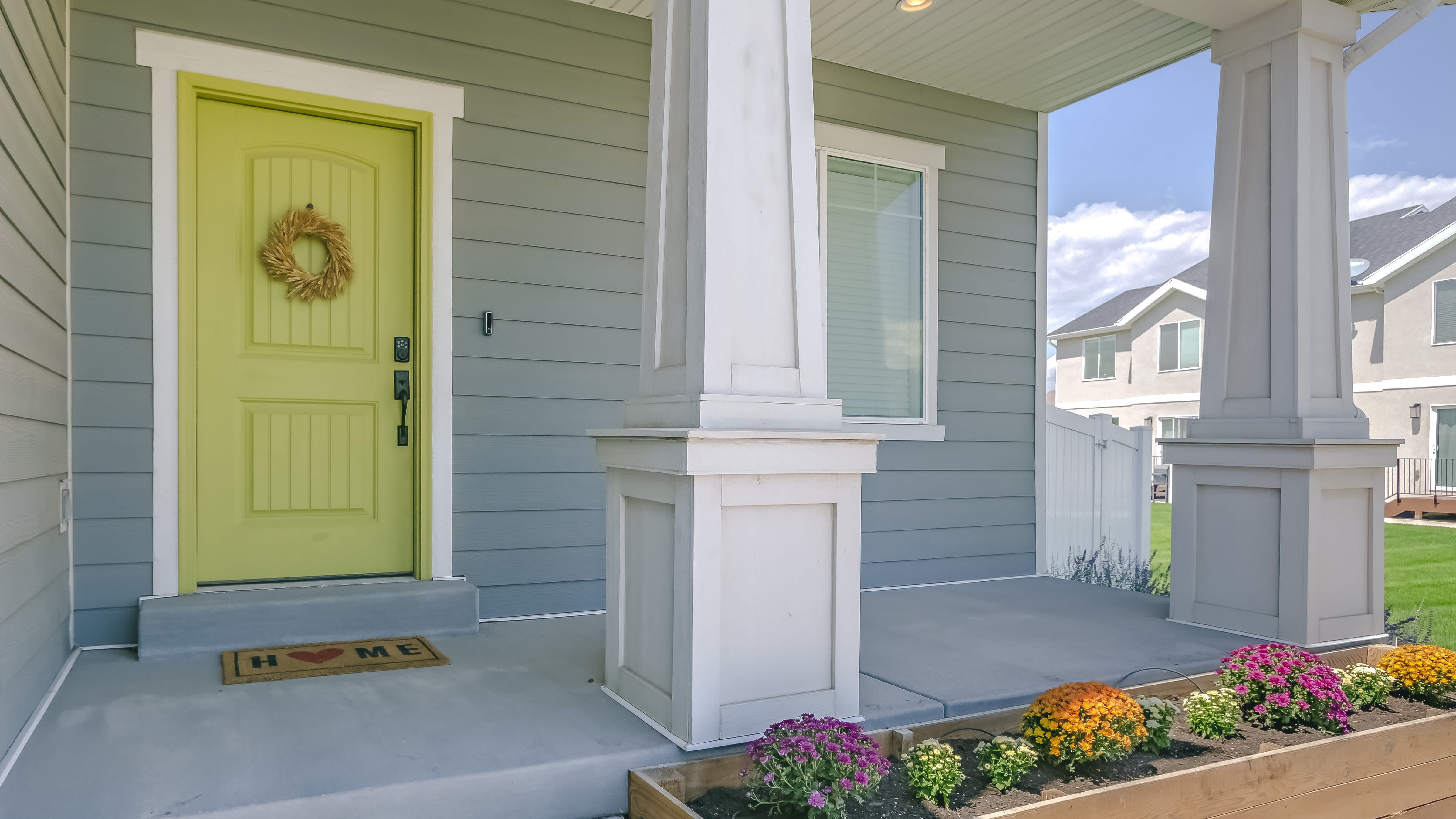 Front porch design with flower box and painted front door