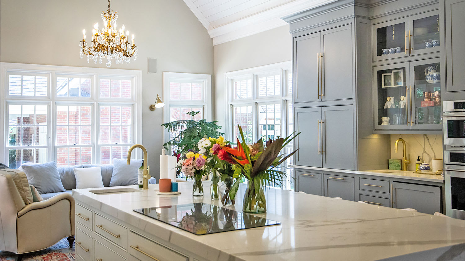 elegant kitchen with flowers and gold accents