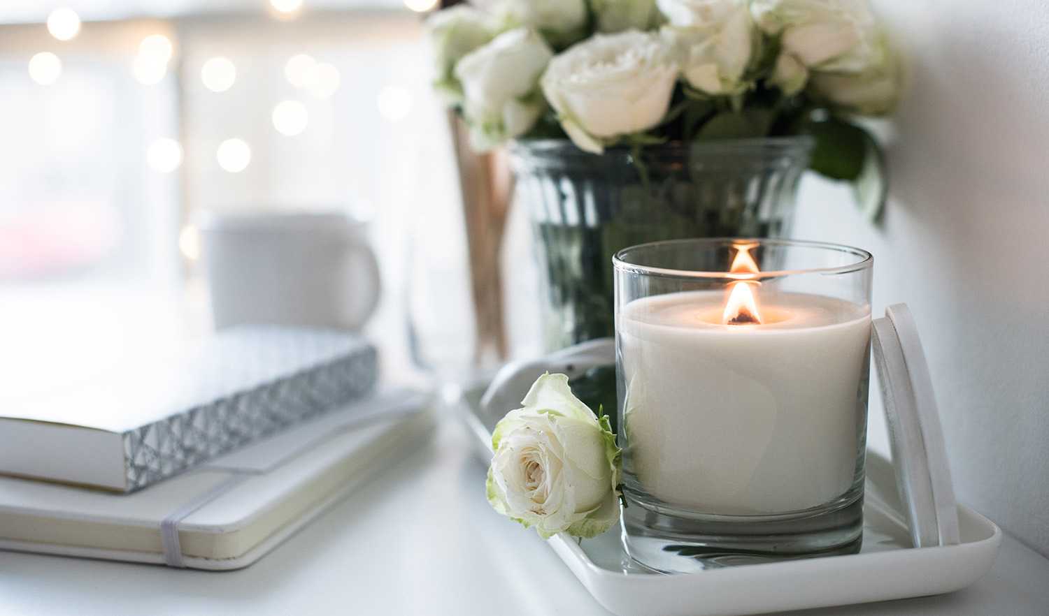 None Candle burning on desk in tray