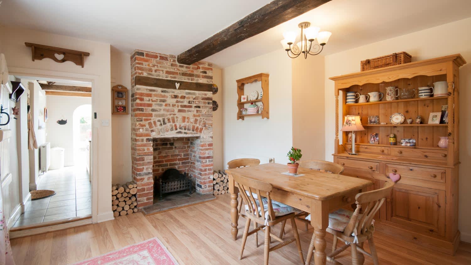 None A kitchen with exposed brick fireplace