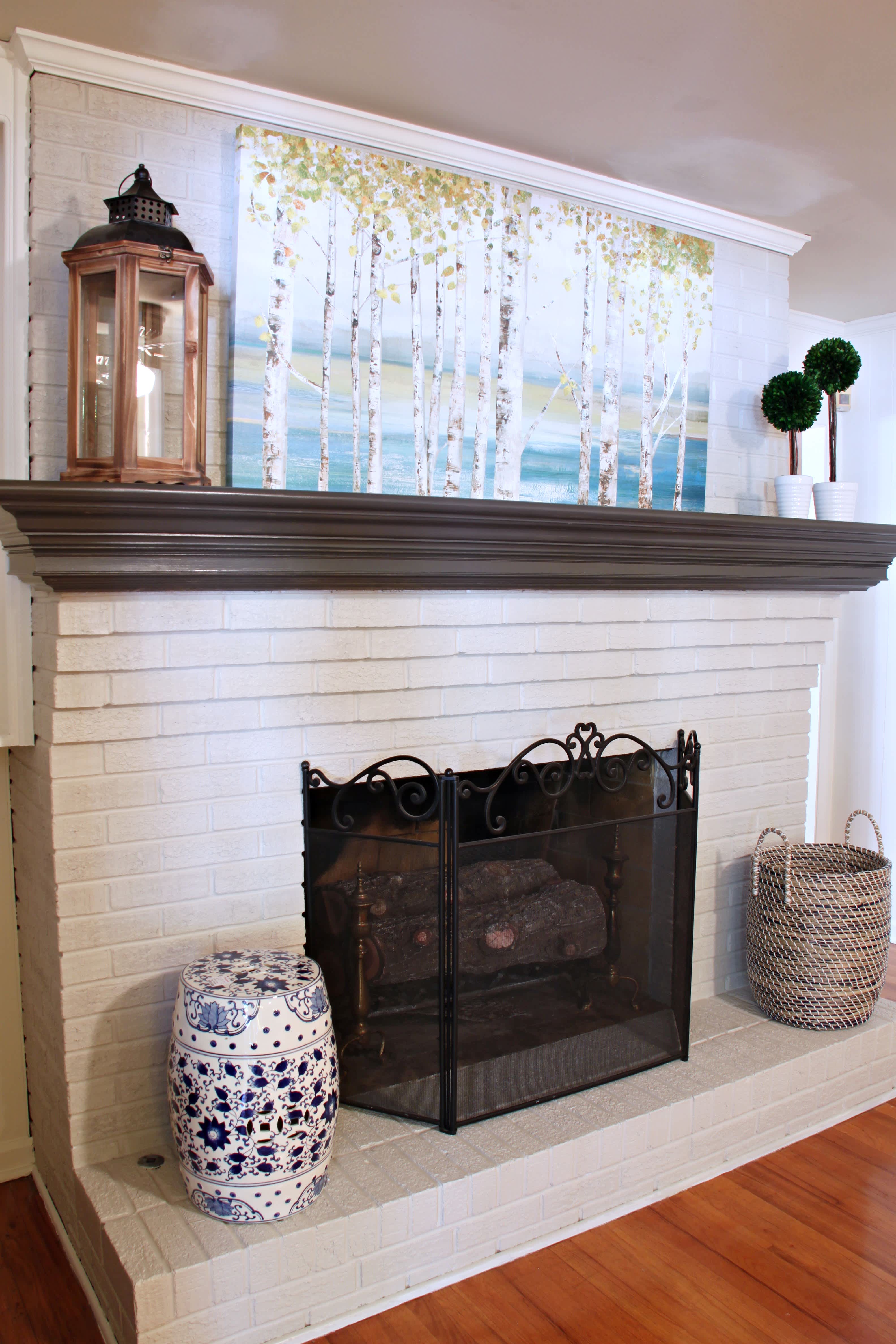 White painted brick fireplace in modern living room