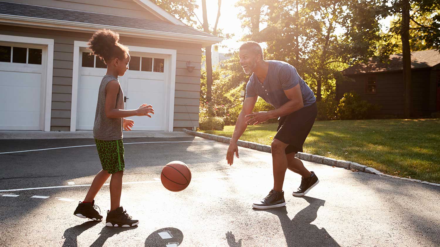 Father and son playing basketball