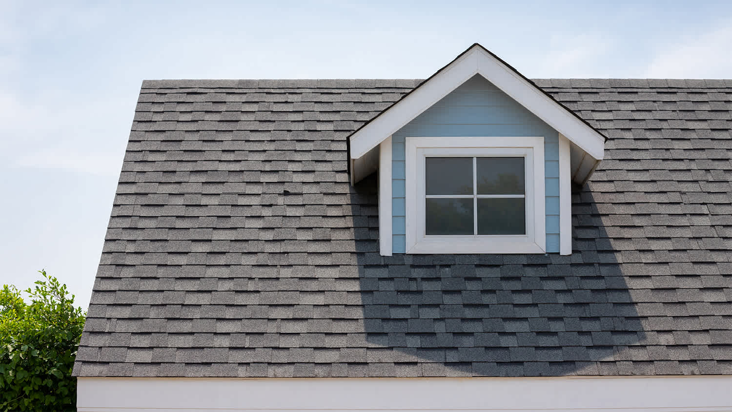 blue house with asphalt shingle roof