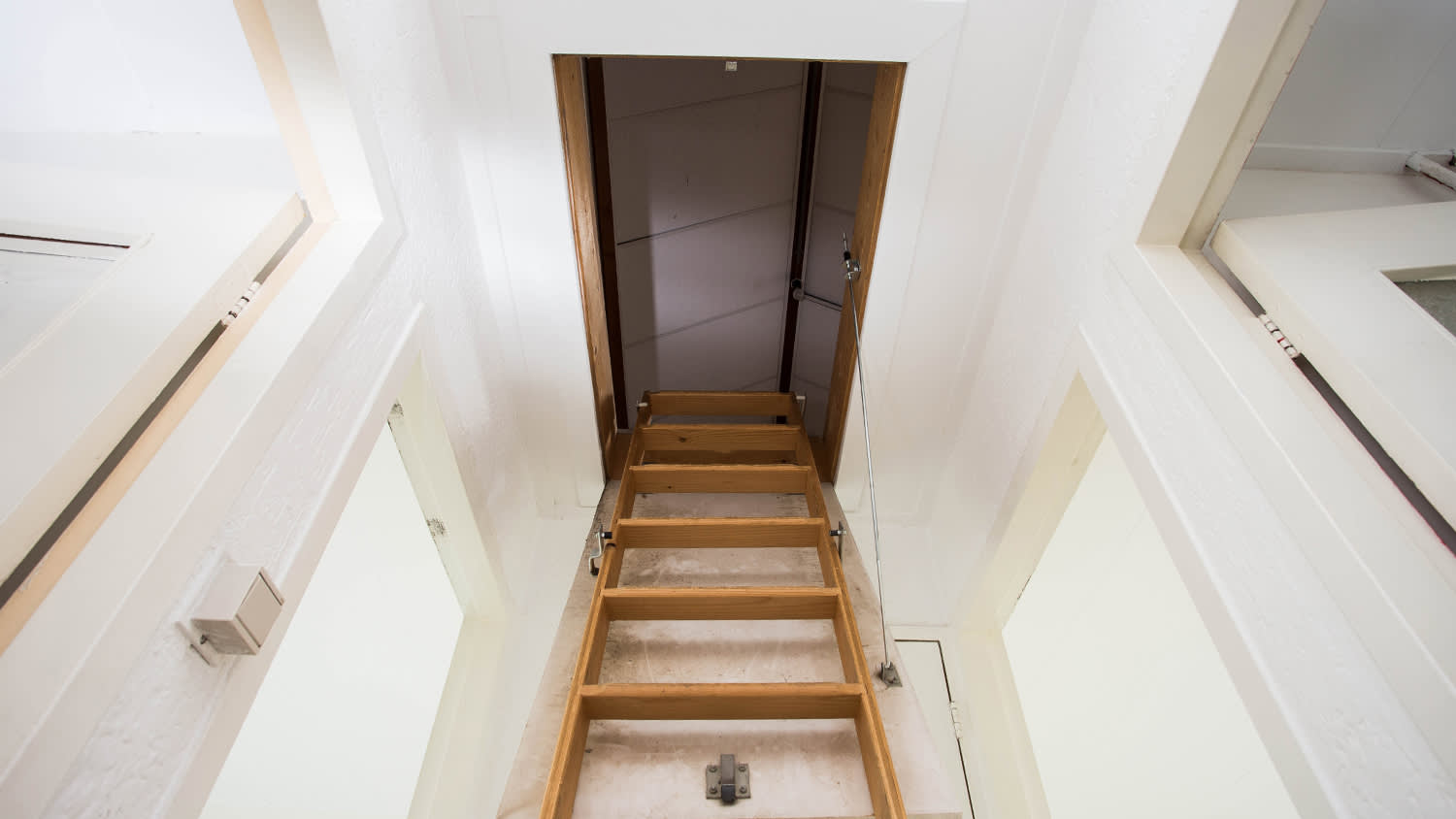 wooden stairs to attic of house