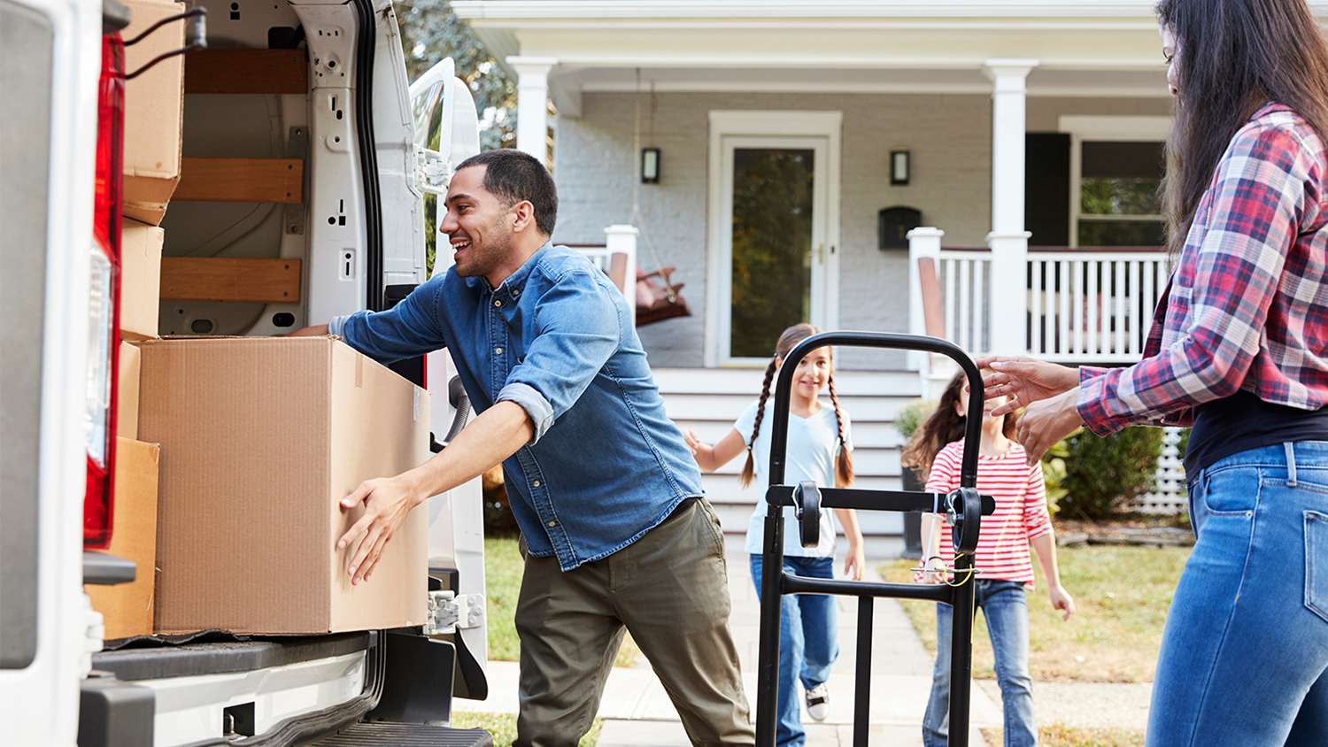 children helping parents load up moving truck
