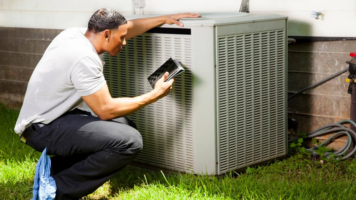 A technician checking an HVAC system