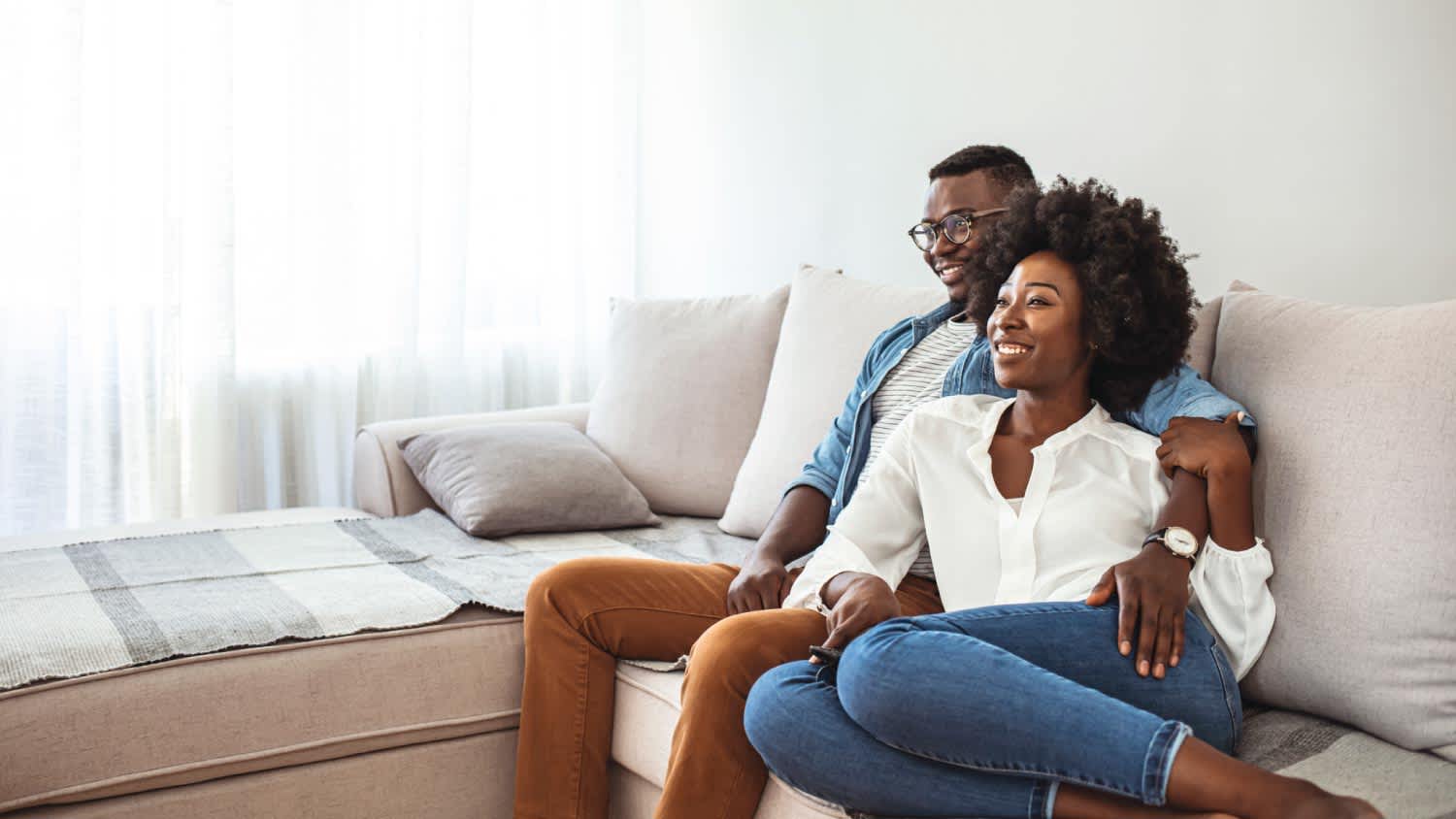 A couple relaxing on sofa