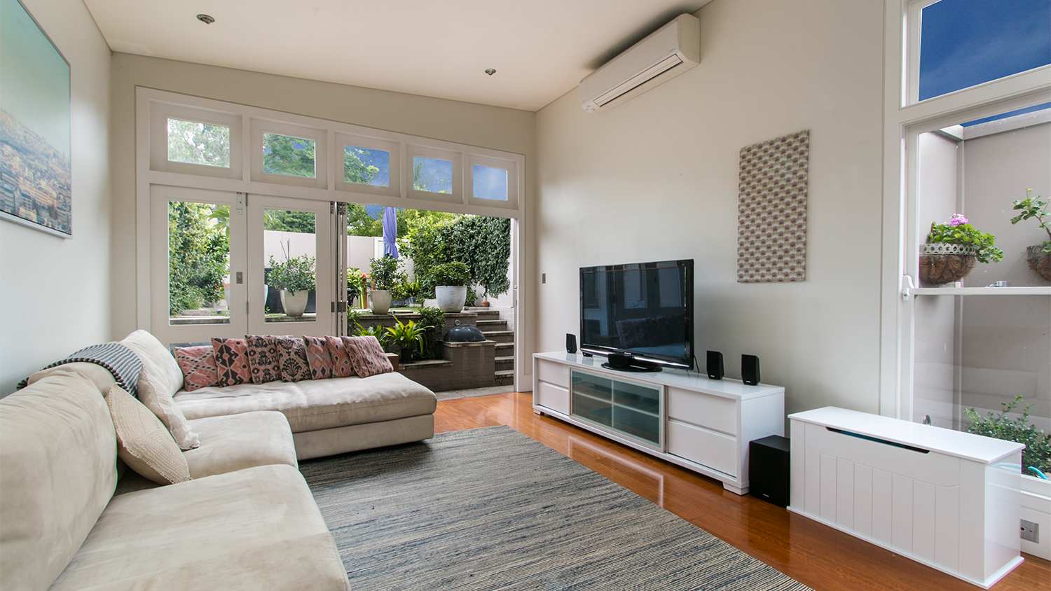 beautiful living room with ac and patio