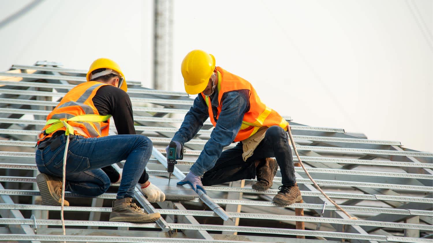 Roofer workers installing new roof