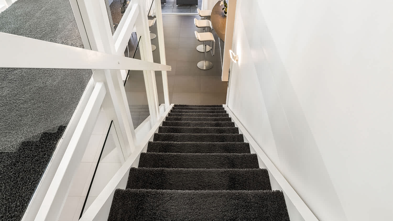 home with dark carpeted stairs