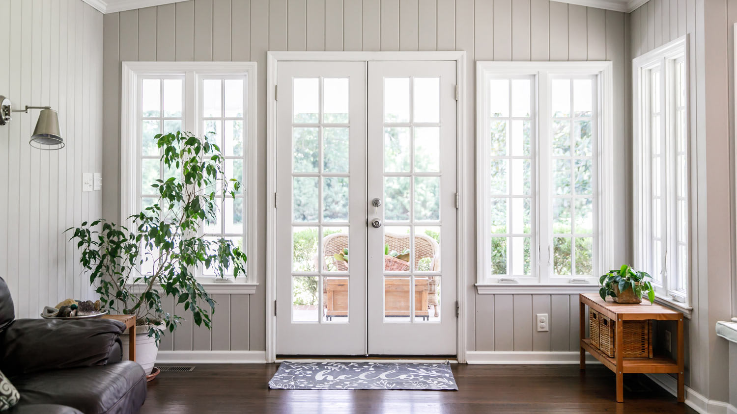 The interior of a sun room with restored old windows