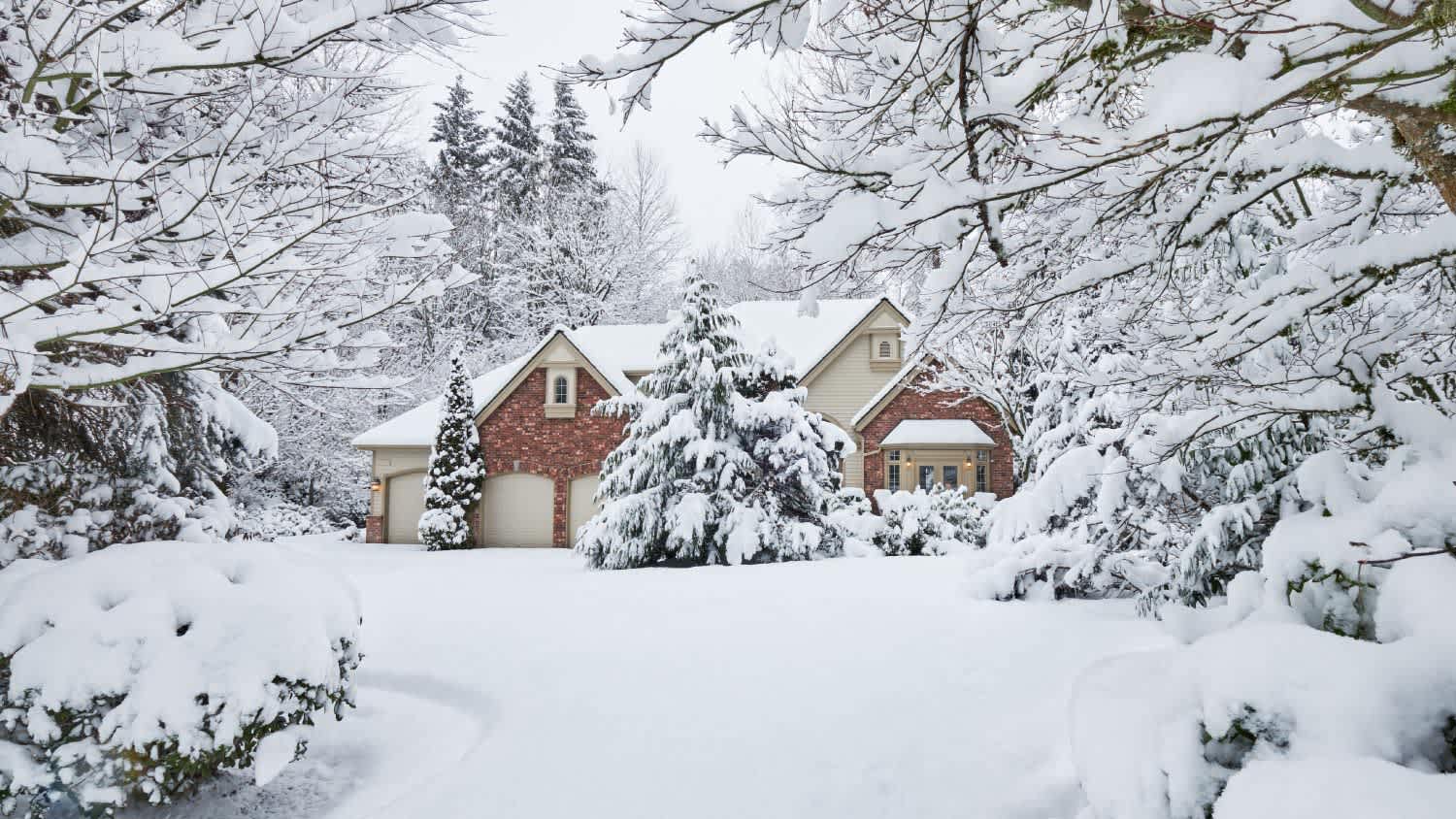 A snowy house on a hill