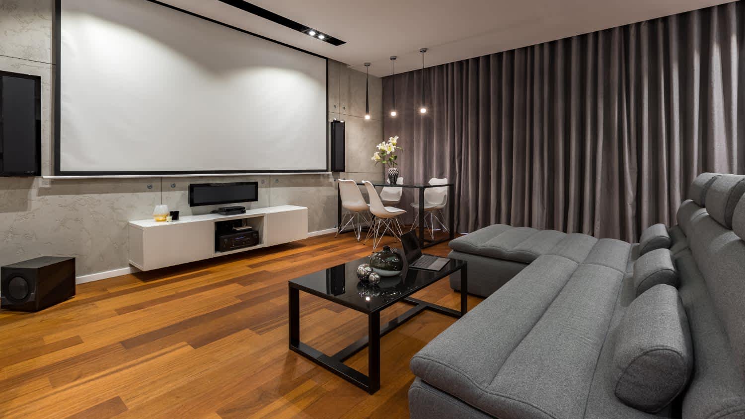 A sofa and projector screen